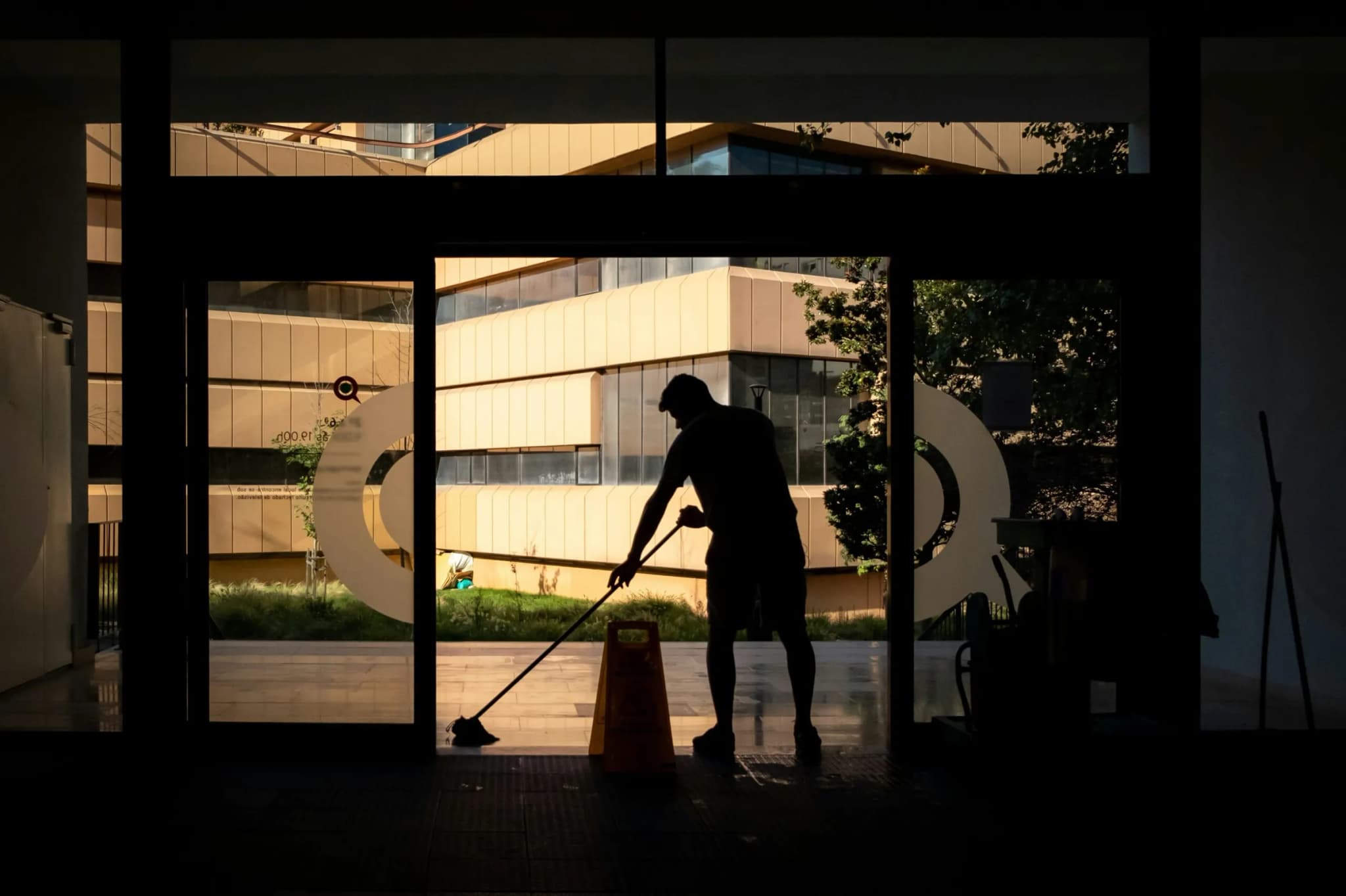 Cleaning the floor at the entrance of a commercial building