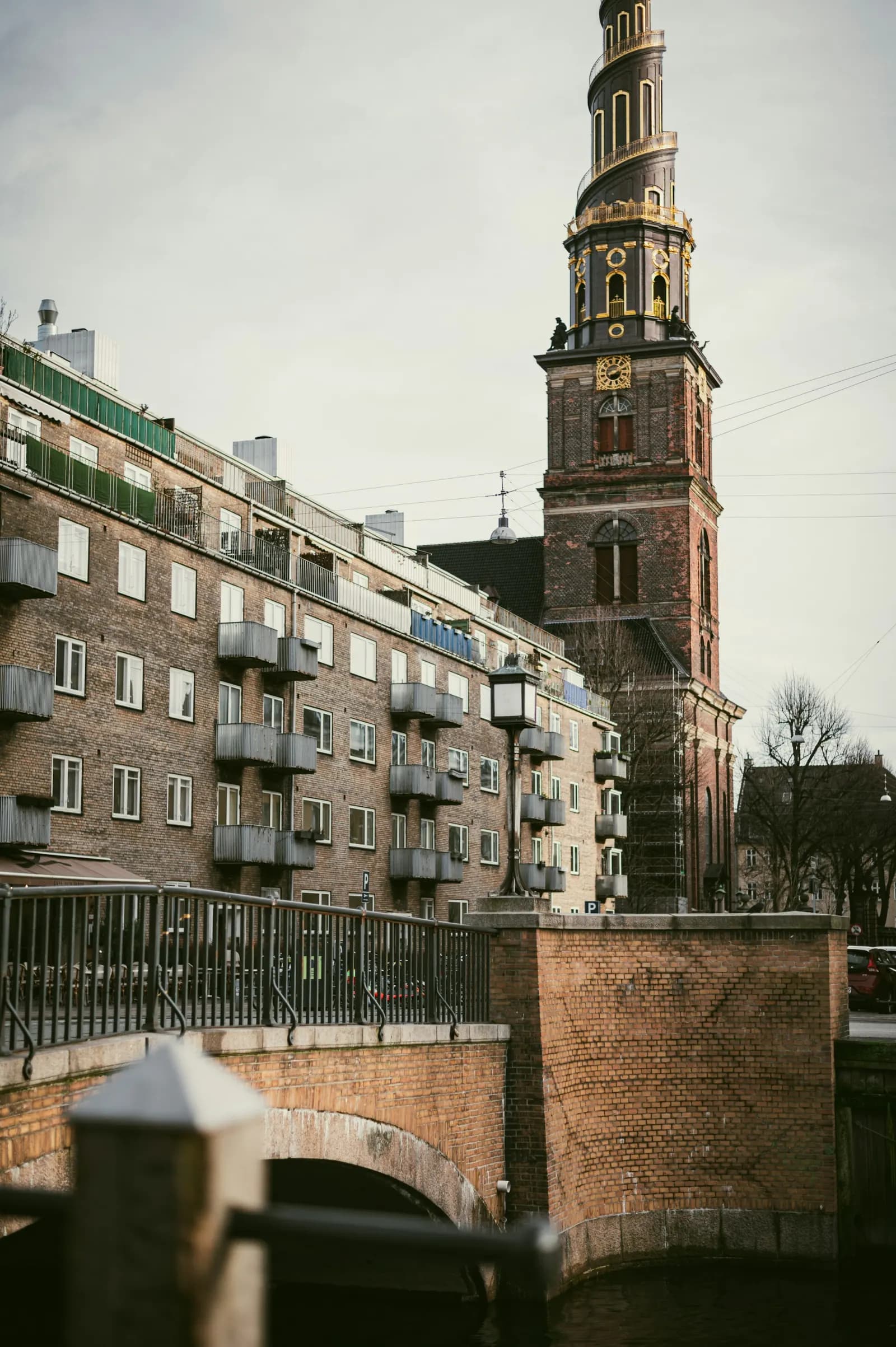 The gilded spiral spire of the Church of Our Saviour seen from a bridge in Christianshavn