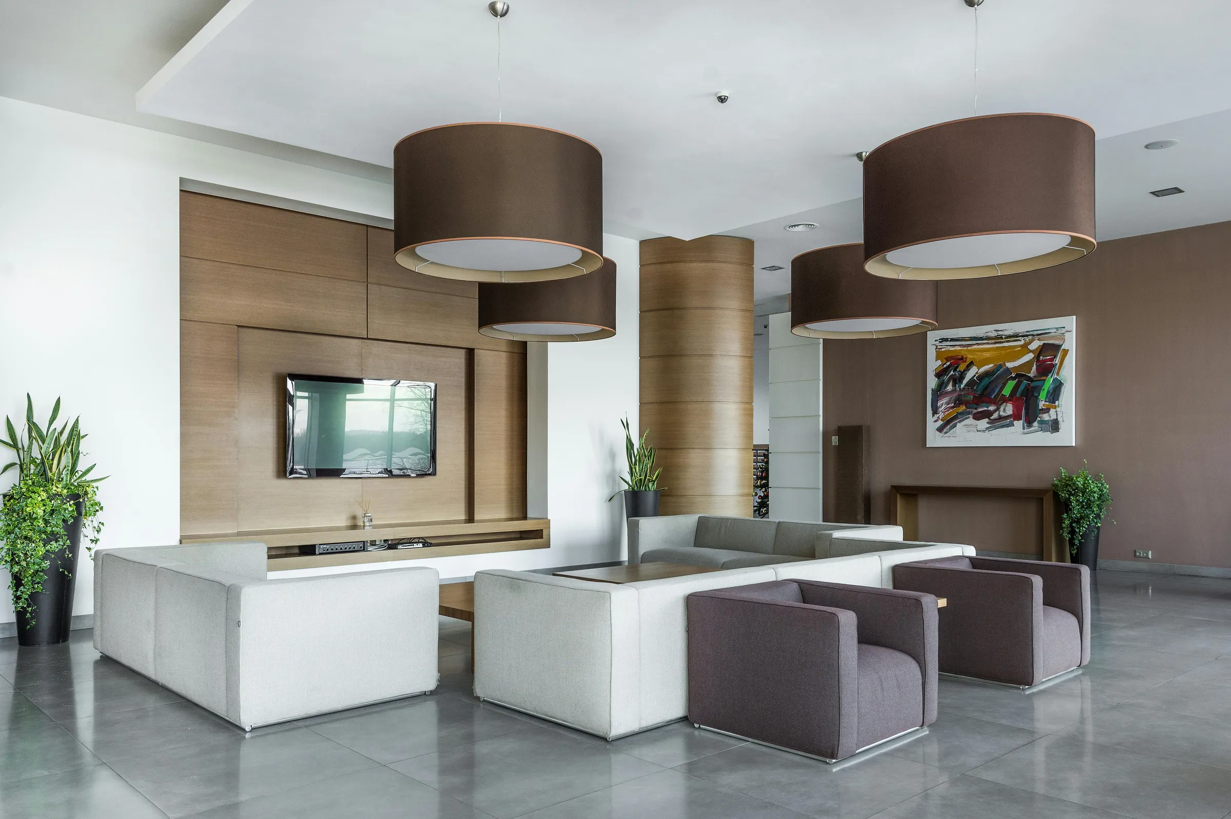 Spacious and elegant modern living room with luxurious furniture and stylish decor.